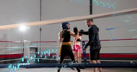 Female boxer punching in ring, coach guiding sparring session with digital overlays