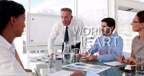 Diverse business meeting promoting world heart day