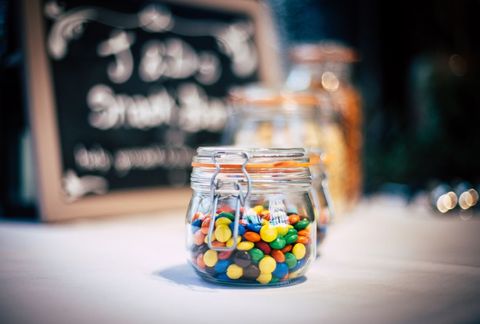 Colorful candy jars in cafe setting