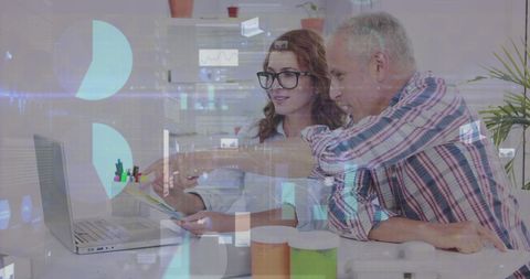 Business Team Analyzing Data on Laptop with Digital Interface Overlay