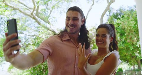 Happy Couple Taking Selfie Outdoors in Sunny Garden