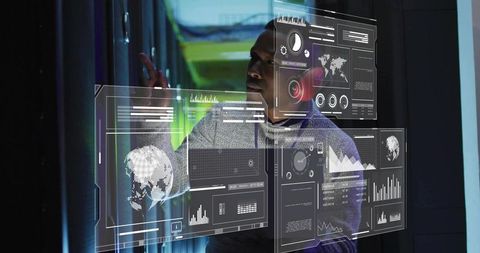 Technician interacting with holographic dashboards in datacenter server aisle