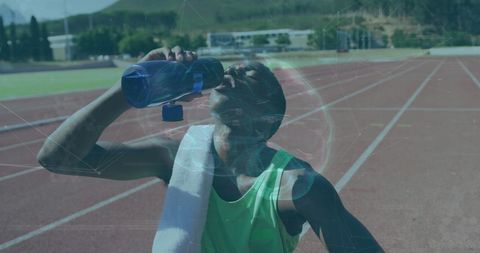 Athlete hydrating after run with technological overlay