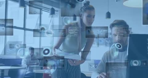 Team Collaborating with Futuristic Virtual Screens in Modern Office