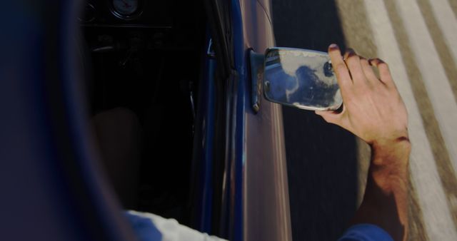 Hand Adjusting Side Mirror of Car While Driving - Download Free Stock Images Pikwizard.com