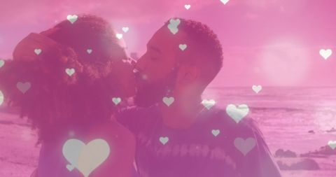 Romantic Beach Kiss with Pink Heart Overlay