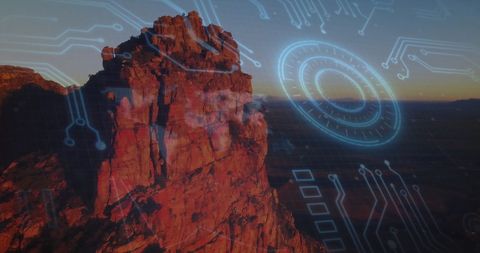 Futuristic Circuit Overlay on Deserted Rocky Landscape