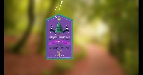 Christmas gift tag with festive icons on blurred background