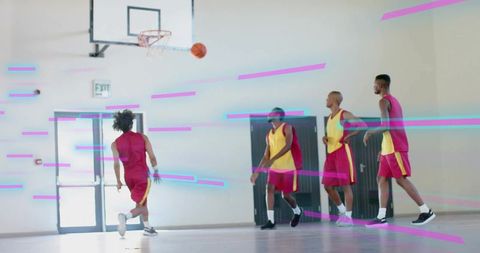 Basketball Players Shooting Hoop in Indoor Gym
