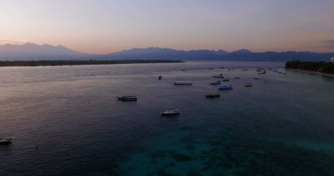 Scenic View of Boats Sailing at Sunrise in Tranquil Waters - Download Free Stock Images Pikwizard.com