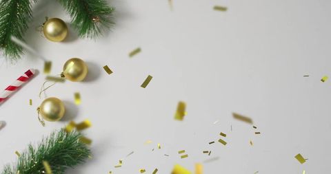 Minimalist Holiday Flatlay Celebrating Gold Baubles Pine Sprigs Candy Cane Confetti