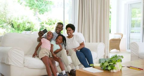 Joyful Family Dance in Living Room Expressing togetherness and Bond