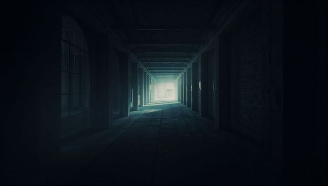 Mysterious Industrial Walkway with Light Filtered Through Hidden End
