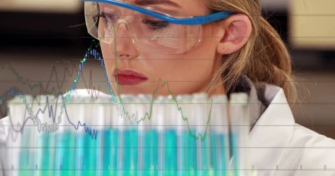 Female Scientist Analyzing Laboratory Data with Test Tubes and Graph Visualization for Research
