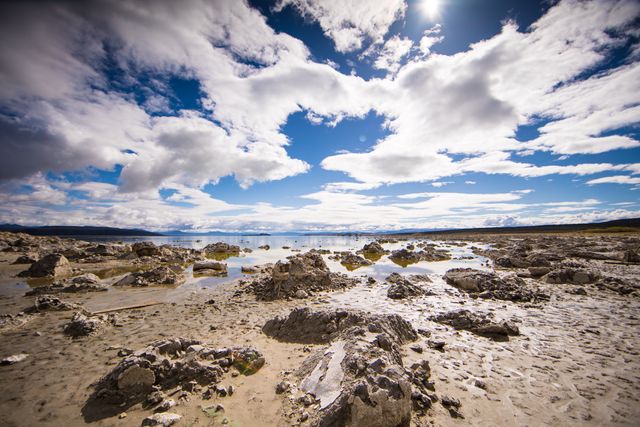 Dramatic Cloudscape Over Rocky Seashore at Low Tide - Download Free Stock Photos Pikwizard.com