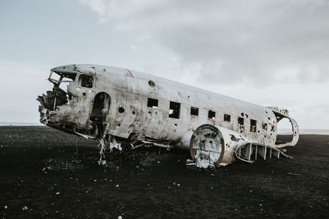 Abandoned aircraft wreckage on desolate landscape