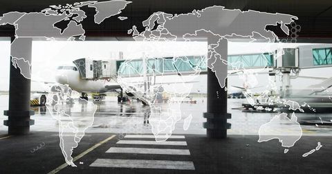 Airport gate jet docking at boarding bridge on rainy tarmac with global network overlay