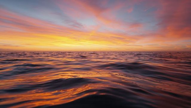 Serene Ocean at Sunset with Vivid Sky Reflections