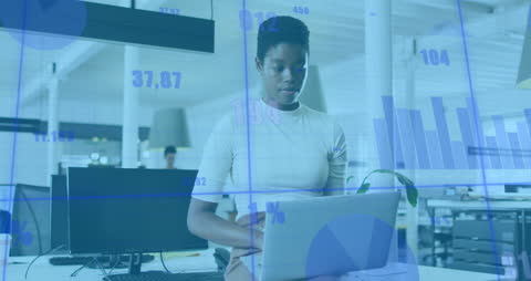 Casual workspace setting with businesswoman interacting with digital data displays. Visible financial charts and graphs overlay, illustrating data analysis and technology use in business. Suitable for visuals illustrating modern business concepts, data analytics, and technology-driven environments.