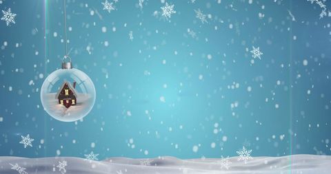 Christmas Bauble Hanging with Snow falling Outdoors in Winter Scene