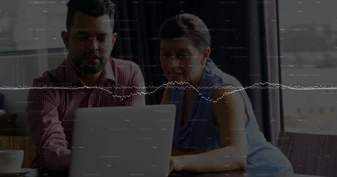 Business Team Analyzing Financial Data on Laptop