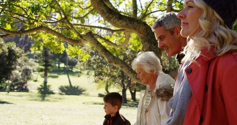 Family Enjoying Sunny Day in Tranquil Park
