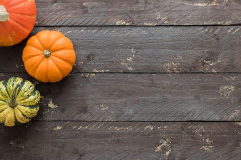 Autumn pumpkins on rustic wooden table