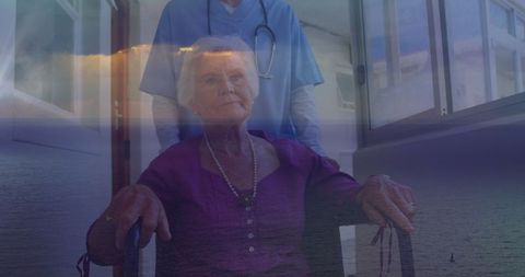 Senior Woman in Wheelchair with Caregiver Over Ocean Scene