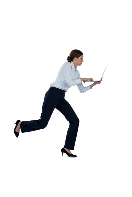Businesswoman running while using laptop against a white background