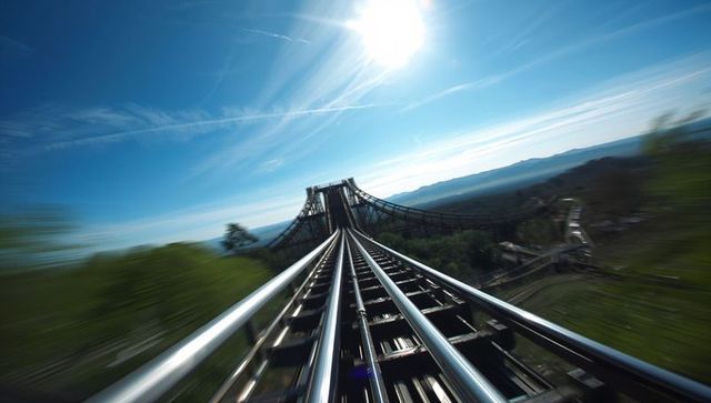 Thrilling roller coaster ride under vibrant sky