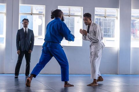 Martial arts training with instructor overseeing practice session