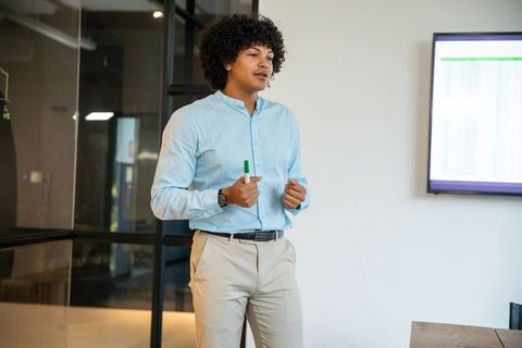 Businessman presenting in modern office conference room