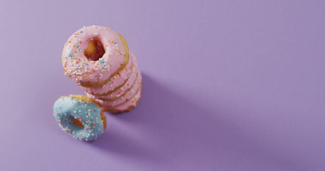 Colorful Assorted Doughnuts on Purple Background - Download Free Stock Images Pikwizard.com
