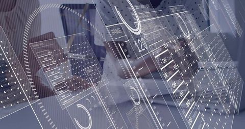 Businesswomen collaborating on laptop with futuristic hud dashboards and data overlays