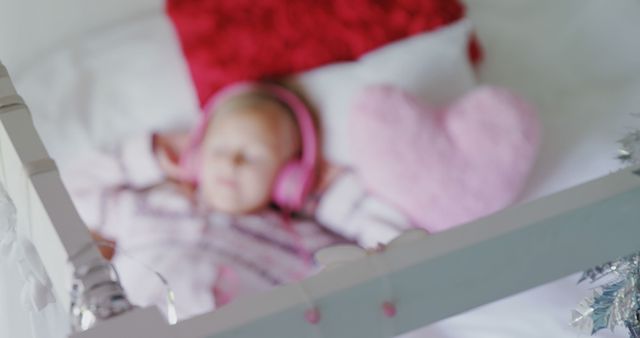 Blurry Baby Sleeping with Pink Headphones in Crib - Download Free Stock Images Pikwizard.com