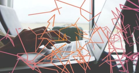 Modern workspace: typing on laptop with abstract overlay for innovation