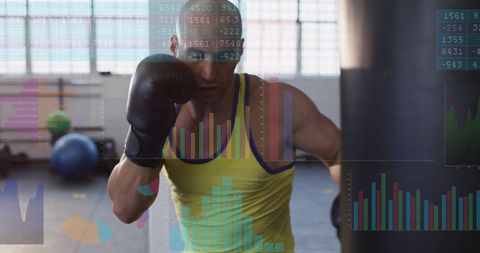 Boxer training with heavy bag while data overlay showing performance and intensity metrics