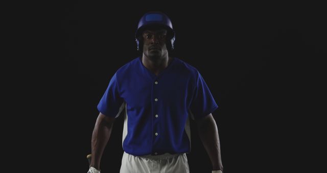 Baseball Player in Helm and Uniform Standing on Black Background - Download Free Stock Images Pikwizard.com