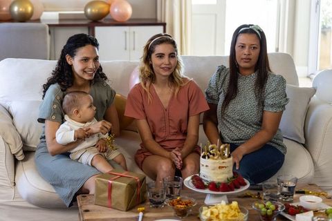 Diverse Mothers and Friend Celebrating Birthday with Cake and Gifts