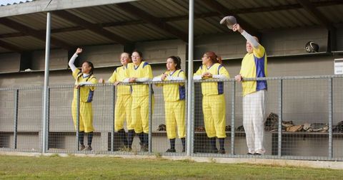 Enthusiastic Baseball Team Cheering from Dugout