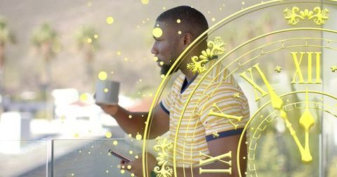 Standing man holding coffee and checking phone on balcony with golden clock overlay