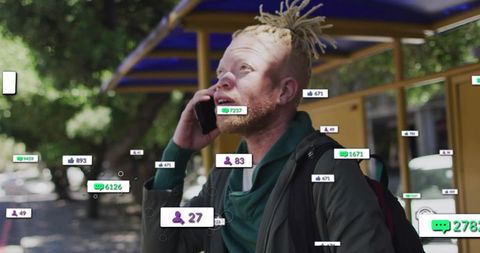 Talking commuter with dreadlocks using phone at urban bus stop with social notifications