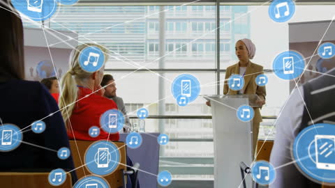 Diverse Team in Office with Networking Icons Illustrating Connectivity