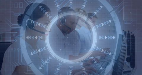 Call Center Agents Typing on Keyboards with Headsets in Office