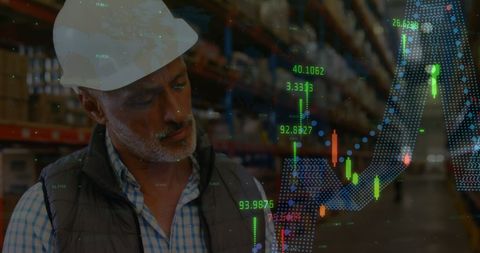 Warehouse Worker Analyzing Financial Graphs and Trends - Download Free Stock Images Pikwizard.com