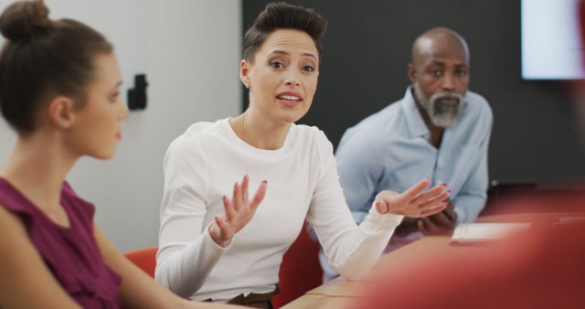 Diverse Business Team Discussing Work in Modern Office Environment - Download Free Stock Images Pikwizard.com