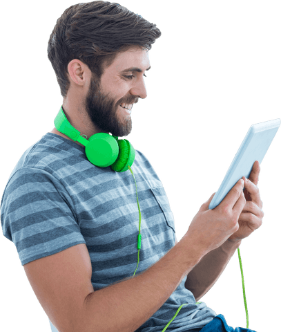 Caucasian Man Using Tablet with Green Headphones on Transparent Background - Download Free Stock Videos Pikwizard.com