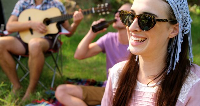 Friends Enjoying Relaxed Outdoor Get-Together with Music and Drinks - Download Free Stock Images Pikwizard.com