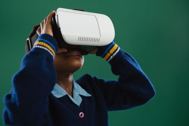 Schoolgirl engaging with virtual reality headset in classroom. Ideal for illustrating modern educational methods, technology in schools, and the integration of digital tools in learning environments. Useful for educational blogs, tech articles, and promotional materials for educational technology.