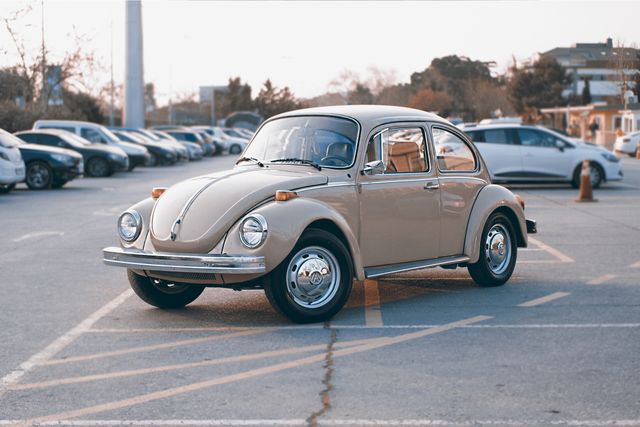 Brown Volkswagen Beetle at Parking Lot - Download Free Stock Photos Pikwizard.com